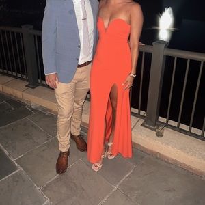 Red mermaid style strapless wedding guest dress